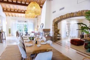a large living room with a table and chairs at Lovely luxury villa with garden and private pool in Sainte-Maxime