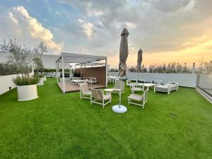 Giardino di HUNAB Roma Apt - Pool, Coworking and Gym NEW
