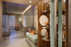 a living room with a room with a couch and a room with a room at Milan Suite Hotel in Milan