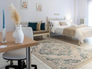 a bedroom with a bed and a table and a desk at 4keys House - Apartment 4 in Tripoli +42 photos
