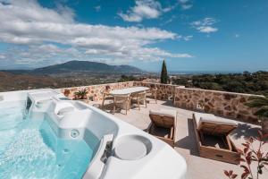 a bath tub sitting on top of a house at Luxury Boutique B&B - Villa Prana Marbella in Ojén