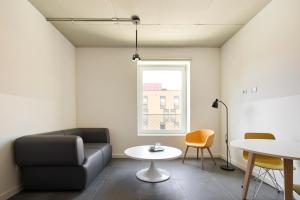 a living room with a couch and a table at aparto Milan Durando in Milan
