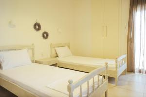 Postel nebo postele na pokoji v ubytování Faros Hotel
