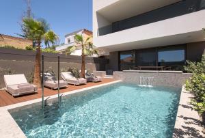 a swimming pool in the backyard of a house at Memoire Guest House I Private Heated Pool I 200m beach in Chania Town