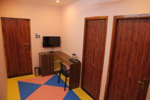 TV/trung tâm giải trí tại Le Apex Tharavaadu