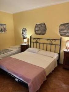 Postel nebo postele na pokoji v ubytování Casetta n.2 con piscina