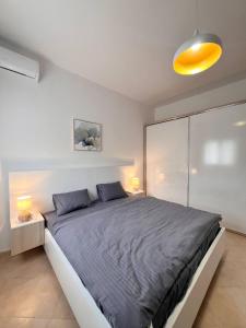 Ένα ή περισσότερα κρεβάτια σε δωμάτιο στο Macys Hideaway Place By Adriatic Living