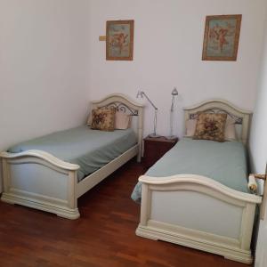 Postel nebo postele na pokoji v ubytování Casa Vittoria + 3 fotografie