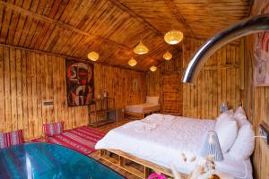 Postel nebo postele na pokoji v ubytování Riad Atlas Bangalow
