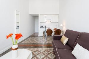 a living room with a couch and a table at Palacio Miraflores in Santa Cruz de Tenerife +22 photos