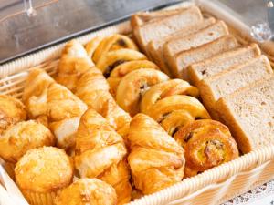 a tray filled with different types of pastries and bread at APA Hotel Akihabara Ekimae in Tokyo