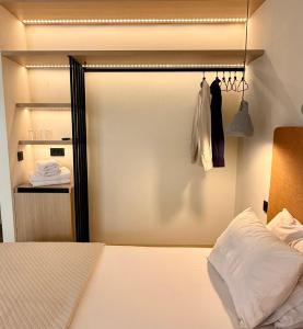 a bedroom with a sliding door with a closet at Yria Hotel in Zakynthos Town