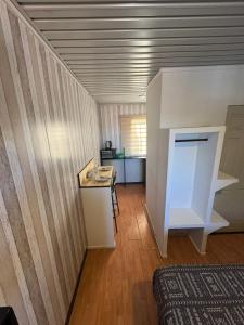a room with a table and a counter in a room at Oasis Mini Deptos in Calama