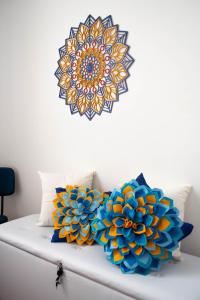 a mandala wall art on a white wall at Apto Centro do Rio - Cinelândia - Consulado Americano - Vivo Rio - 1 min Metrô in Rio de Janeiro