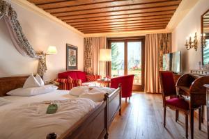 Postel nebo postele na pokoji v ubytování Thermenwelt Hotel Pulverer