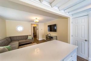 a living room with a couch and a table at Stylish 2BR n Old Town Greenwood in Greenwood