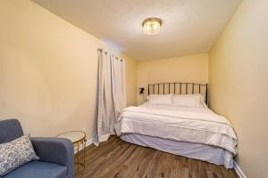 a small bedroom with a bed and a couch at Stylish 2BR n Old Town Greenwood in Greenwood