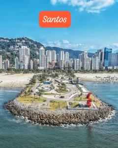 an island in the water next to a beach at 100 mts Praia Ar Condicionado Wi-Fi 600 Roupa Cama Toalha 24 hs in Santos
