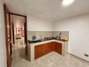 a kitchen with a sink and a counter top at Jaichi KIREI in Cajamarca