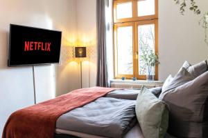 Ένα ή περισσότερα κρεβάτια σε δωμάτιο στο Design Studio - Netflix, Nespresso, Zentral