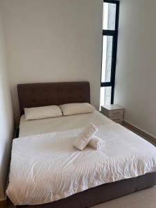 Ένα ή περισσότερα κρεβάτια σε δωμάτιο στο Coco homes seaview at The Shore