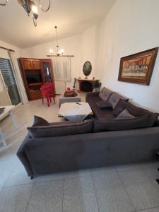 a living room with a couch and a table at iraklitsa house in Iraklitsa