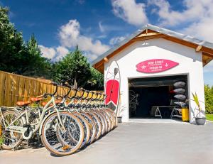 a row of bikes parked in front of a building at Hatton - 650m do plaży ! in Grzybowo