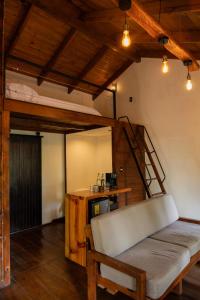 a room with a bunk bed and a ladder at Cotan Ecolodge in La Esperanza