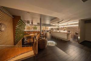 a restaurant with a pool table and a piano at Wellness Hostel Central in Prague
