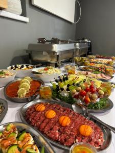 a buffet filled with many different types of food at Rezydencja Karnat in Karpacz