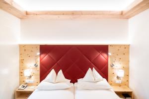 Postel nebo postele na pokoji v ubytování Thermenwelt Hotel Pulverer