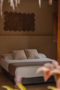 Ένα ή περισσότερα κρεβάτια σε δωμάτιο στο MAKAI BEACH HOSTEL