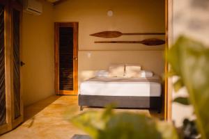 Ένα ή περισσότερα κρεβάτια σε δωμάτιο στο MAKAI BEACH HOSTEL