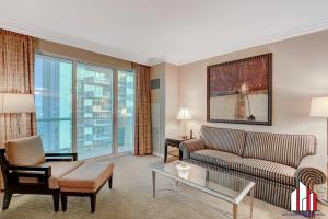 a living room with a couch and a table at MGM Signature-15-802 1Br 2Ba F1 Pits View Balcony in Las Vegas