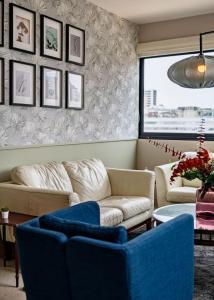 Posezení v ubytování Stylish Apt with Pool and Gym