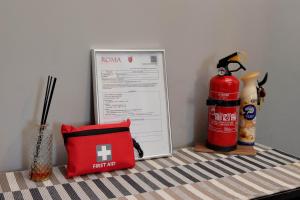 a table with a first aid kit and a fire hydrant at Eur Trepini Luxury Loft in Rome