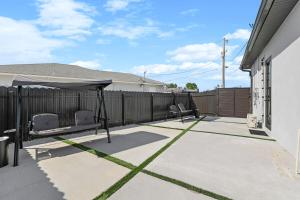 a patio with two chairs under a canopy at Oasis Paradise at Cape Coral in Cape Coral