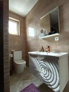 Koupelna v ubytování Apartmani Jozić