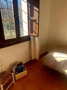 a bedroom with a bed and a window at La Casa de Cadia 2 in El Real de San Vicente +21 photos