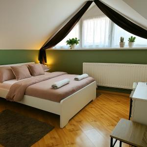 Postel nebo postele na pokoji v ubytování Zöld Sziget Üdülőház