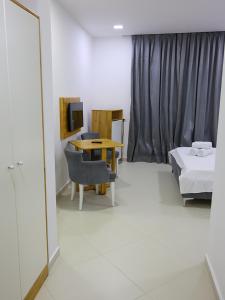 Postel nebo postele na pokoji v ubytování Hotel Adria