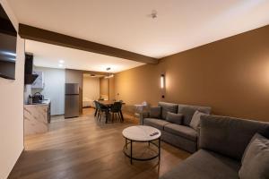 a living room with a couch and a table at Emily Suites in Benidorm