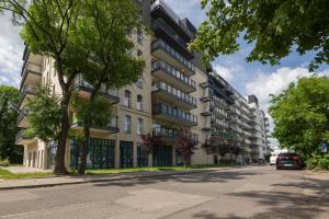 an empty street in front of an apartment building at Rezydencja Wrocław Legnicka in Wrocław