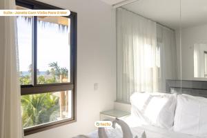 Ένα ή περισσότερα κρεβάτια σε δωμάτιο στο Studio equipado e completo no VG Sun Cumbuco +50 φωτογραφίες