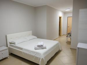 Postel nebo postele na pokoji v ubytování Hotel Adria