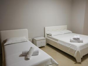 Postel nebo postele na pokoji v ubytování Hotel Adria