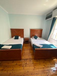 Voodi või voodid majutusasutuse Manzzel Cairo House toas