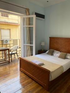 Postel nebo postele na pokoji v ubytování Manzzel Cairo House