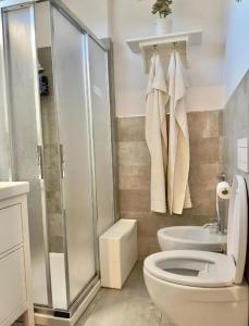 a bathroom with a shower and a toilet and a sink at Charming apartment in Monterosso al Mare with balcony in Monterosso al Mare