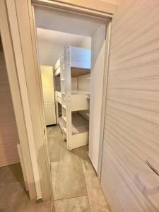 an empty closet with a white door in a room at Charming apartment in Monterosso al Mare with balcony in Monterosso al Mare